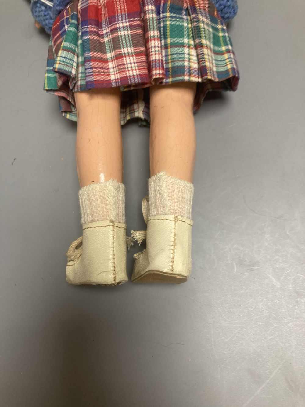 An Armand Marseille bisque boy doll, mould 990 with fixed glass eyes, 30cm, a bisque doll with jointed composition body, 47cm and a pai